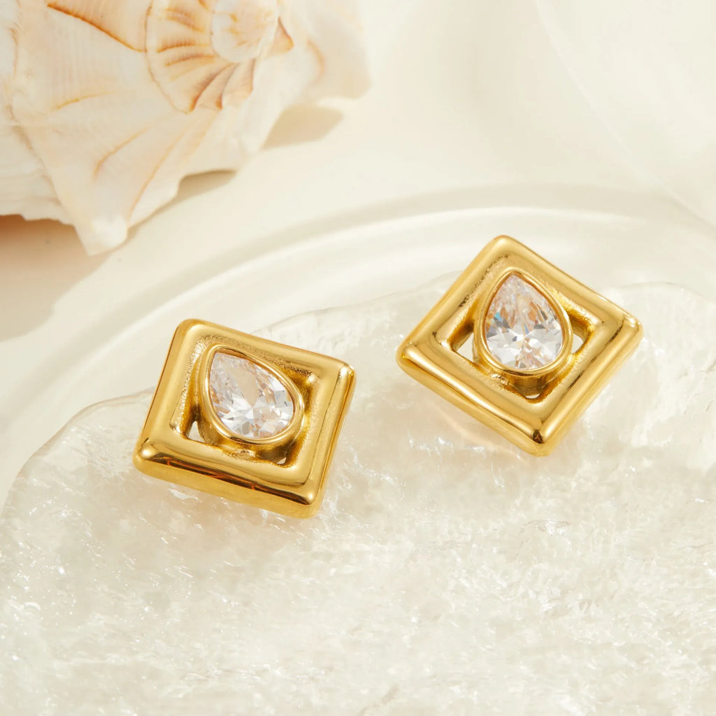 Gold geometric stud earrings for women with inlaid water drop shaped zircon stones.