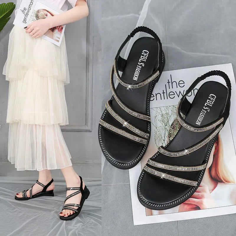 Korean style women's flat sandals with rhinestone decoration on a PU upper and rubber sole, shown in gold colour.