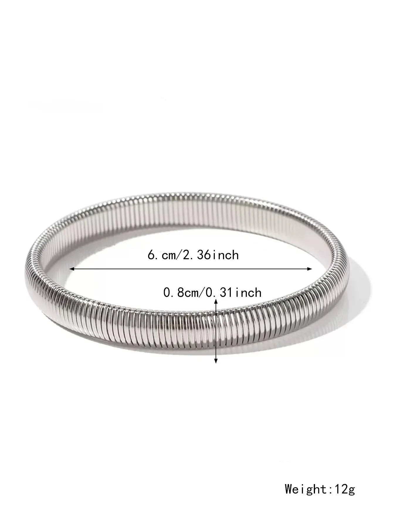 Close-up of a women's elastic titanium steel bracelet featuring a bold vertical stripe ring pattern in a gold tone finish.