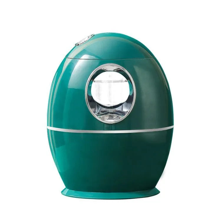 White round USB-powered aromatherapy spray humidifier on a table.