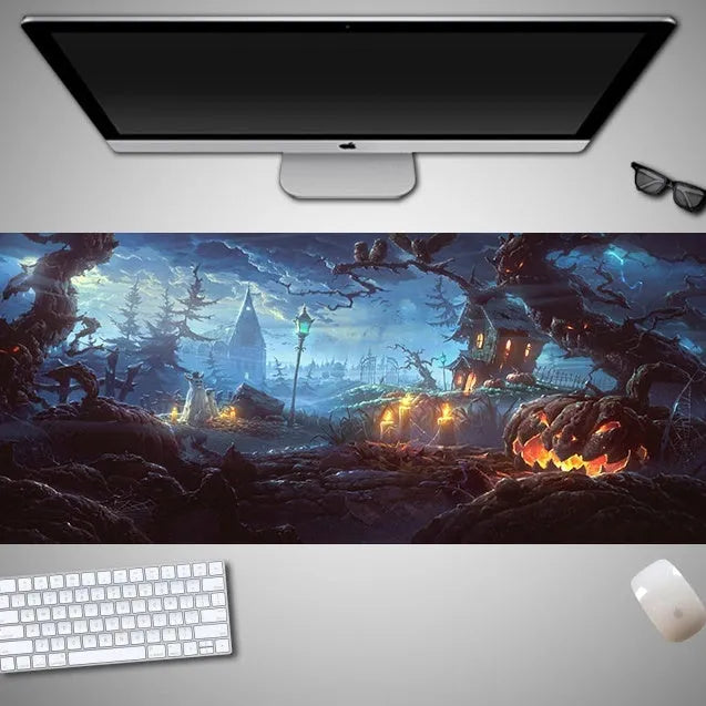 Large Halloween-themed computer mouse pad with graphic design on a desk
