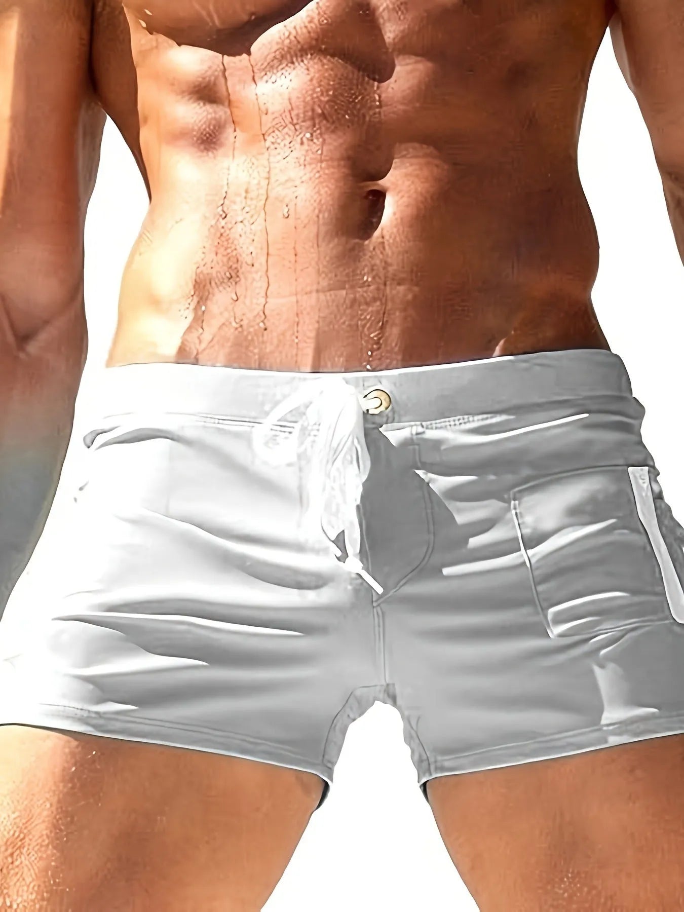 Men's black high-waist swimming trunks with a lace-up front and briefs style.