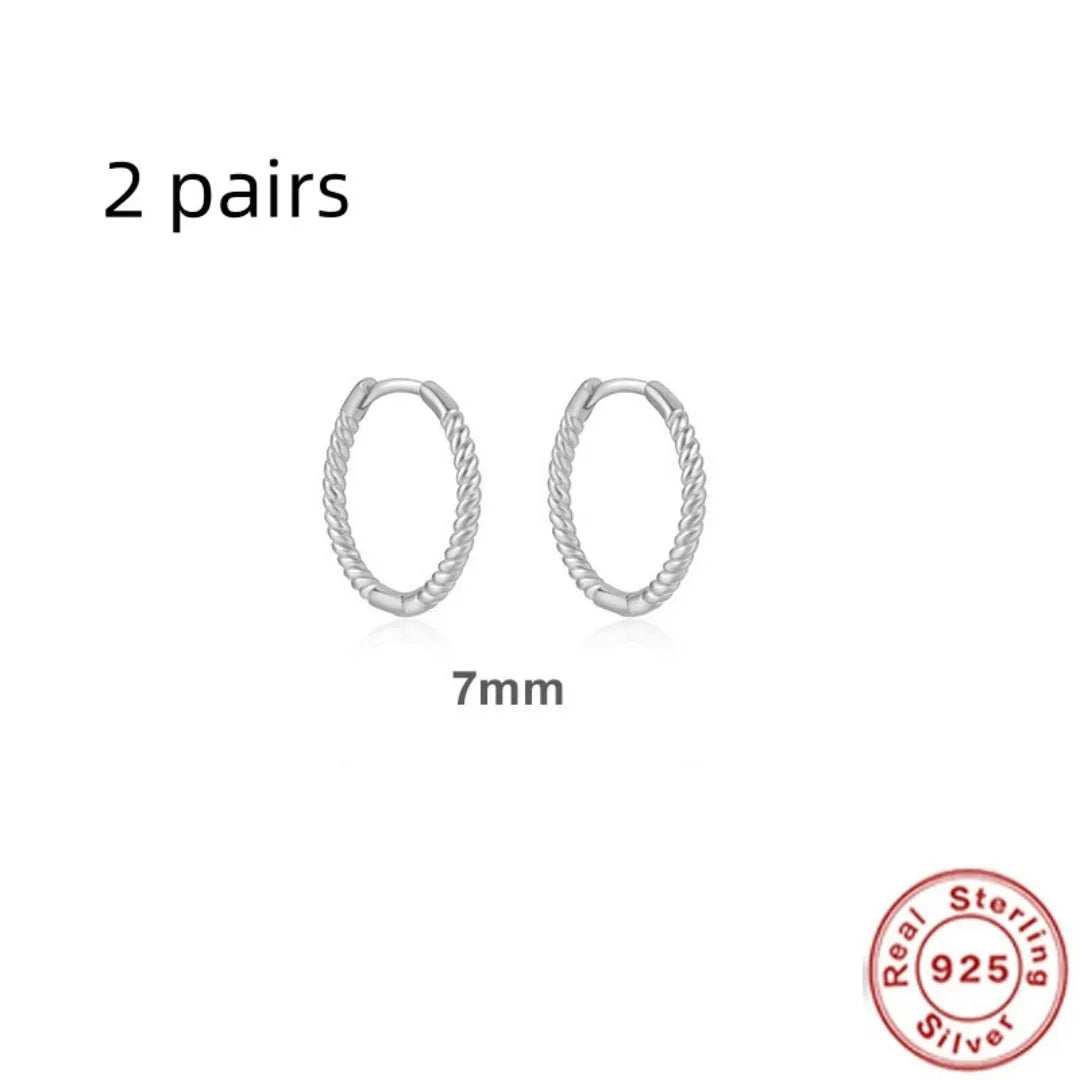 Sterling silver twisted ring earrings in geometric round design with gold or platinum finish