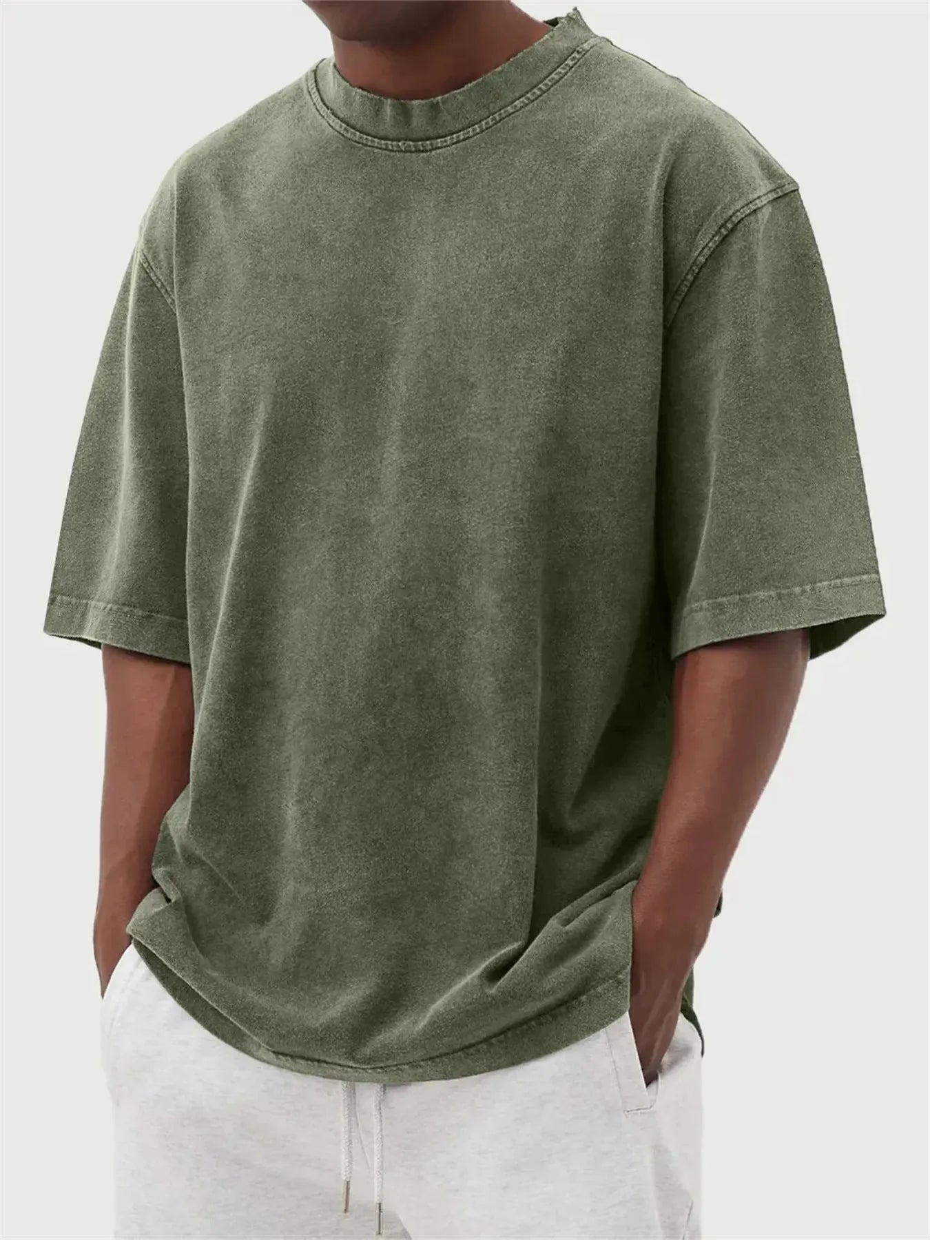 Men's washed distressed pullover t-shirt in solid colour with loose fit and stone washed finish