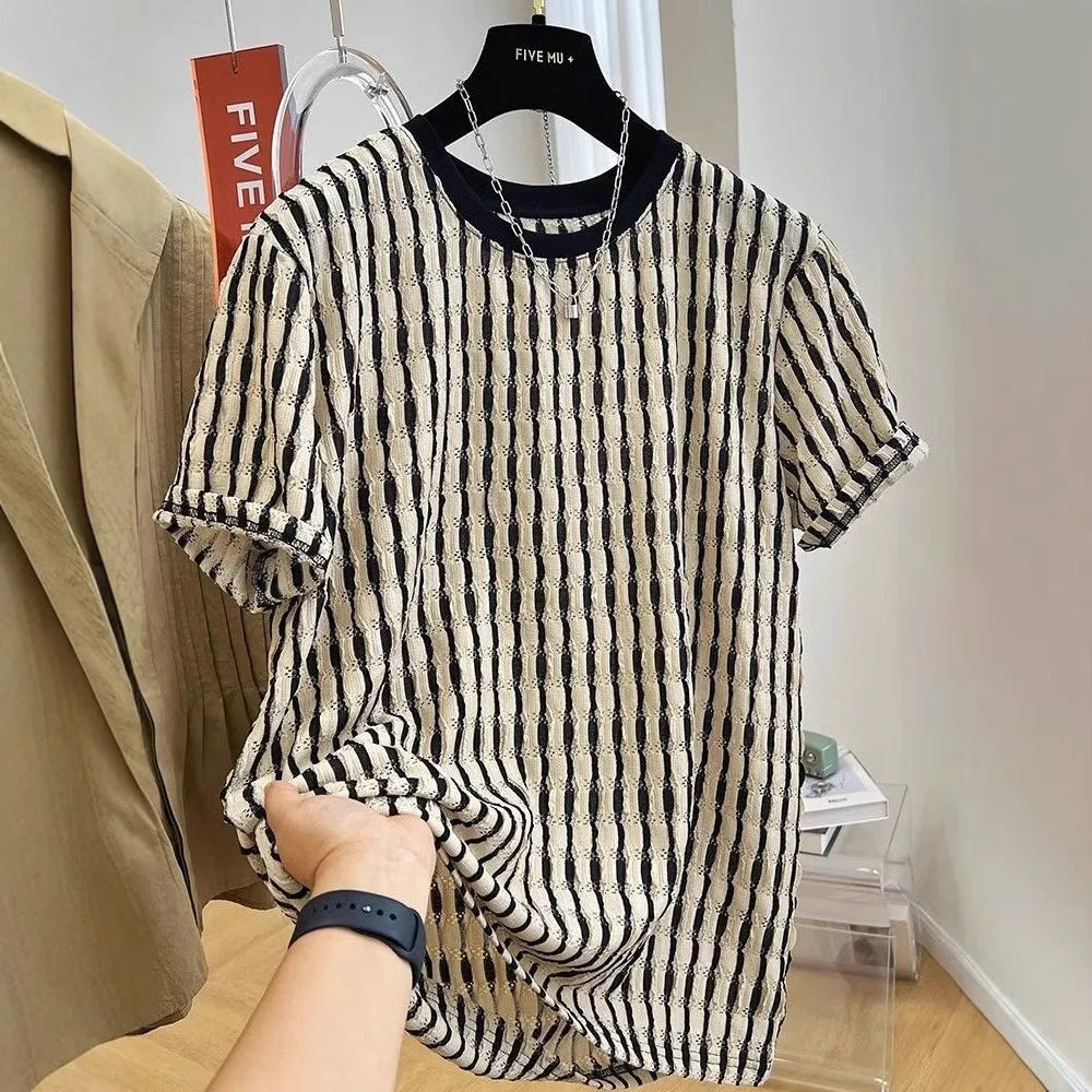 Men's black and white striped short sleeve linen shirt with loose fit pullover style displayed on flat lay
