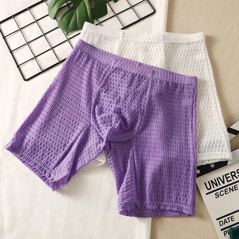 Men's solid colour lace boxers with a lengthened hip-lifting shaping design on a size chart.