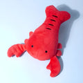Red lobster-shaped squeaky dog toy for small and medium breeds on white background