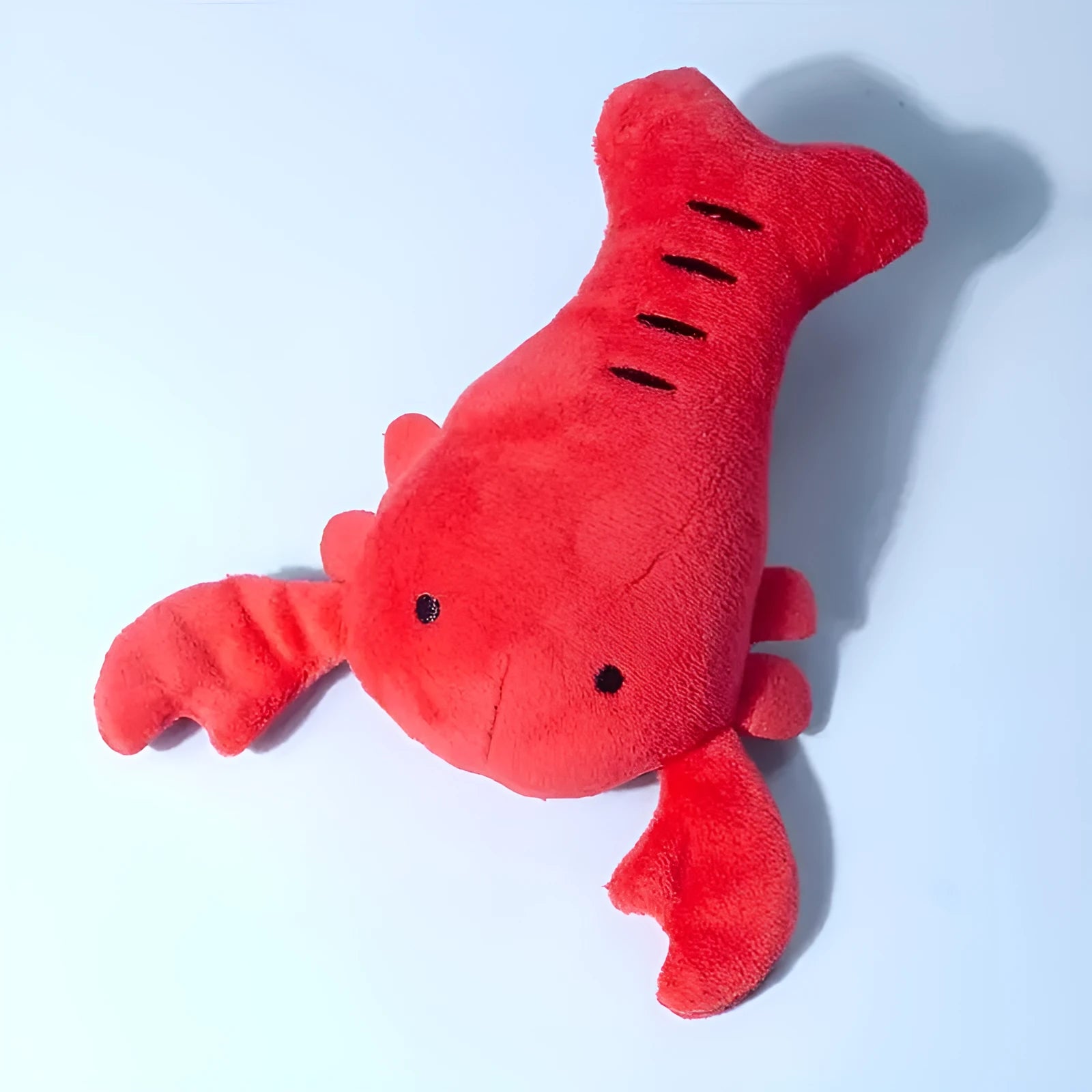 Red lobster-shaped squeaky dog toy for small and medium breeds on white background