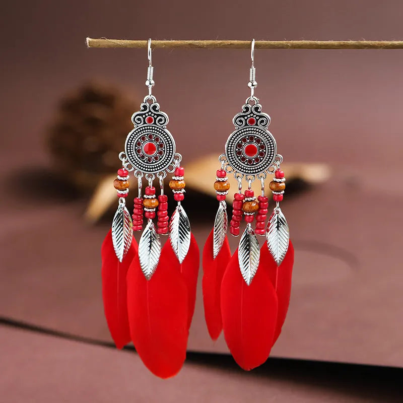 Round drop feather earrings with leaf detailing in various bohemian colours