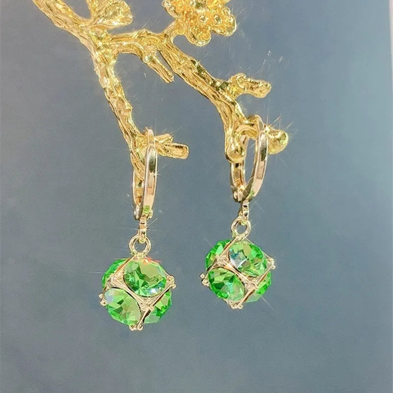 Geometric rose detail zircon earrings for women in copper, available in multiple colours.