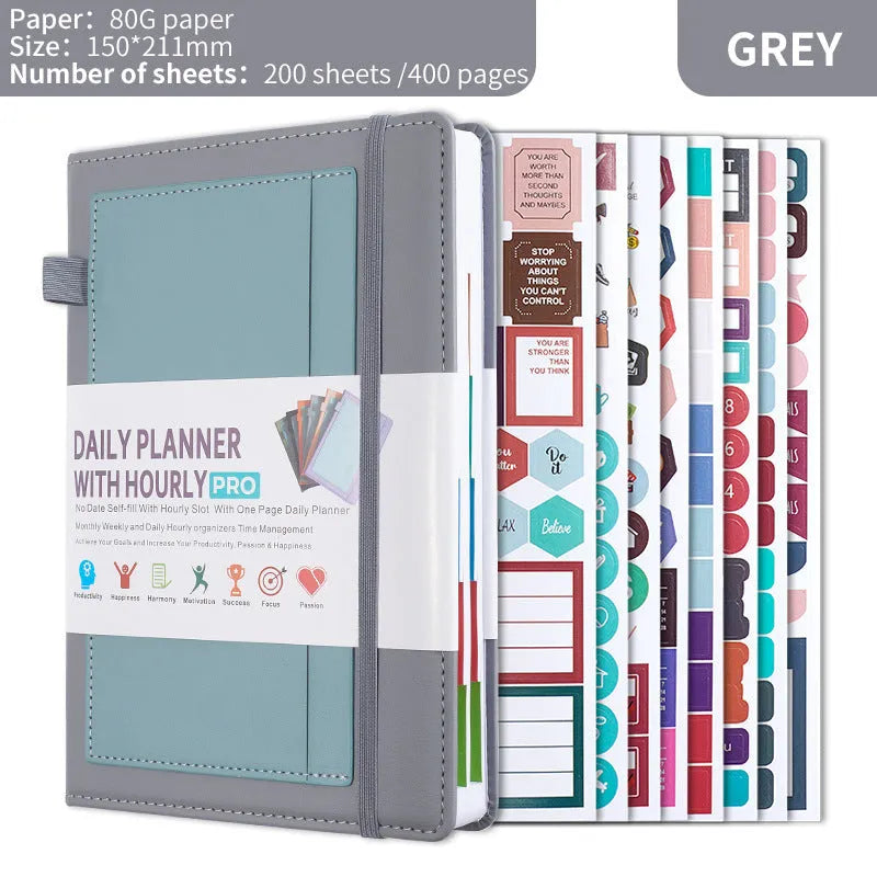 A5 notebook with purple PU cover closed by a black elastic strap