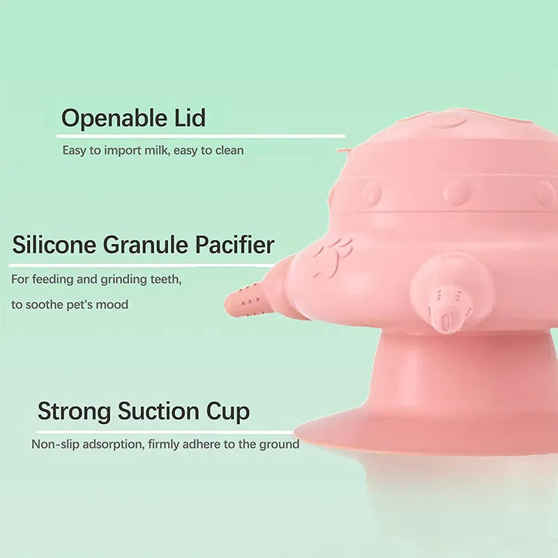Pink silicone pet nursing device with milk bowl and four pacifiers for puppies and kittens.