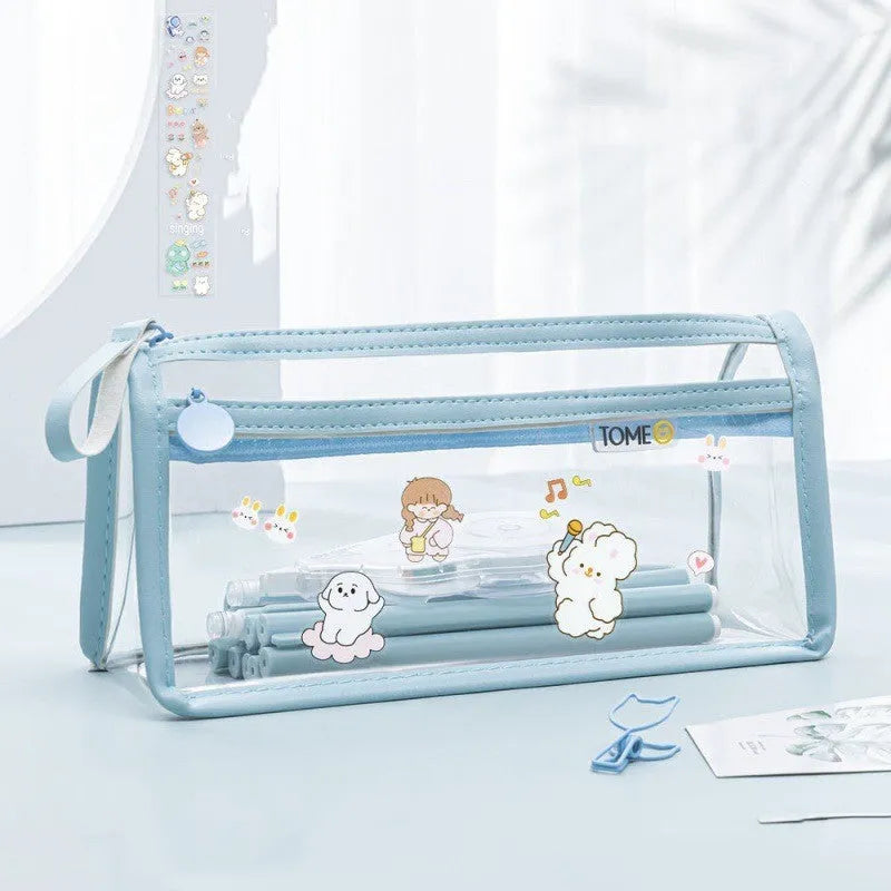 Transparent double-layer pencil case showing two compartments with writing instruments inside, dimensions 220x110x80mm