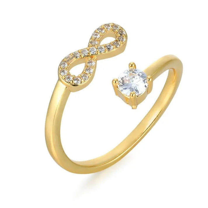 Open geometric metal ring with inlaid zircon letter personalisation in gold finish.