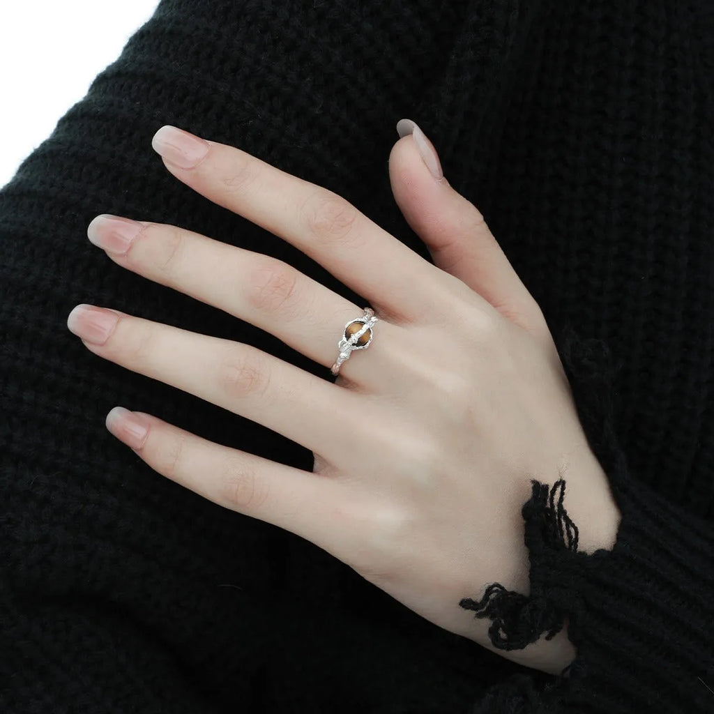 White gold colour Saturn Tigereye open adjustable ring for women on display