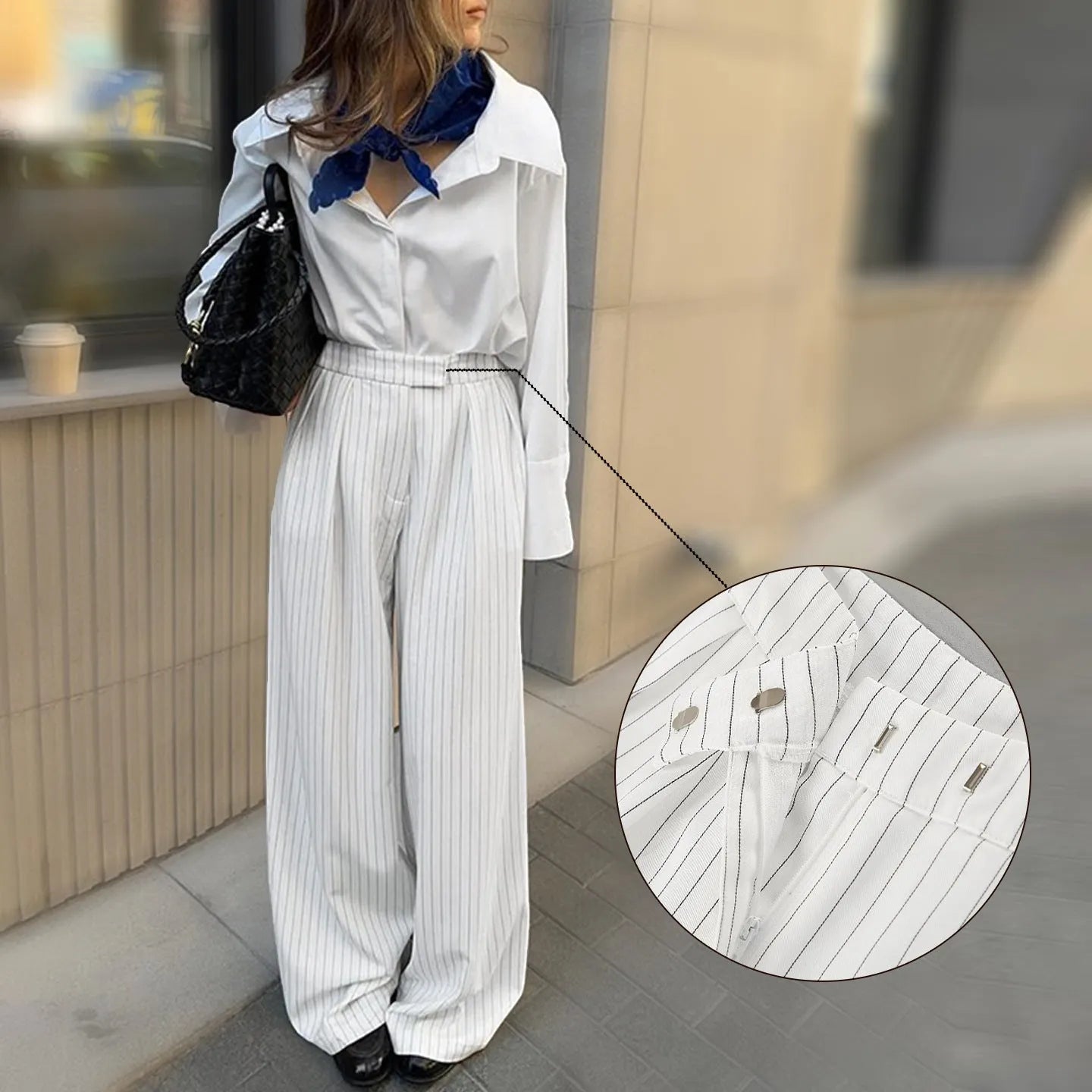 White striped wide-leg trousers with front zipper detail and loose casual fit