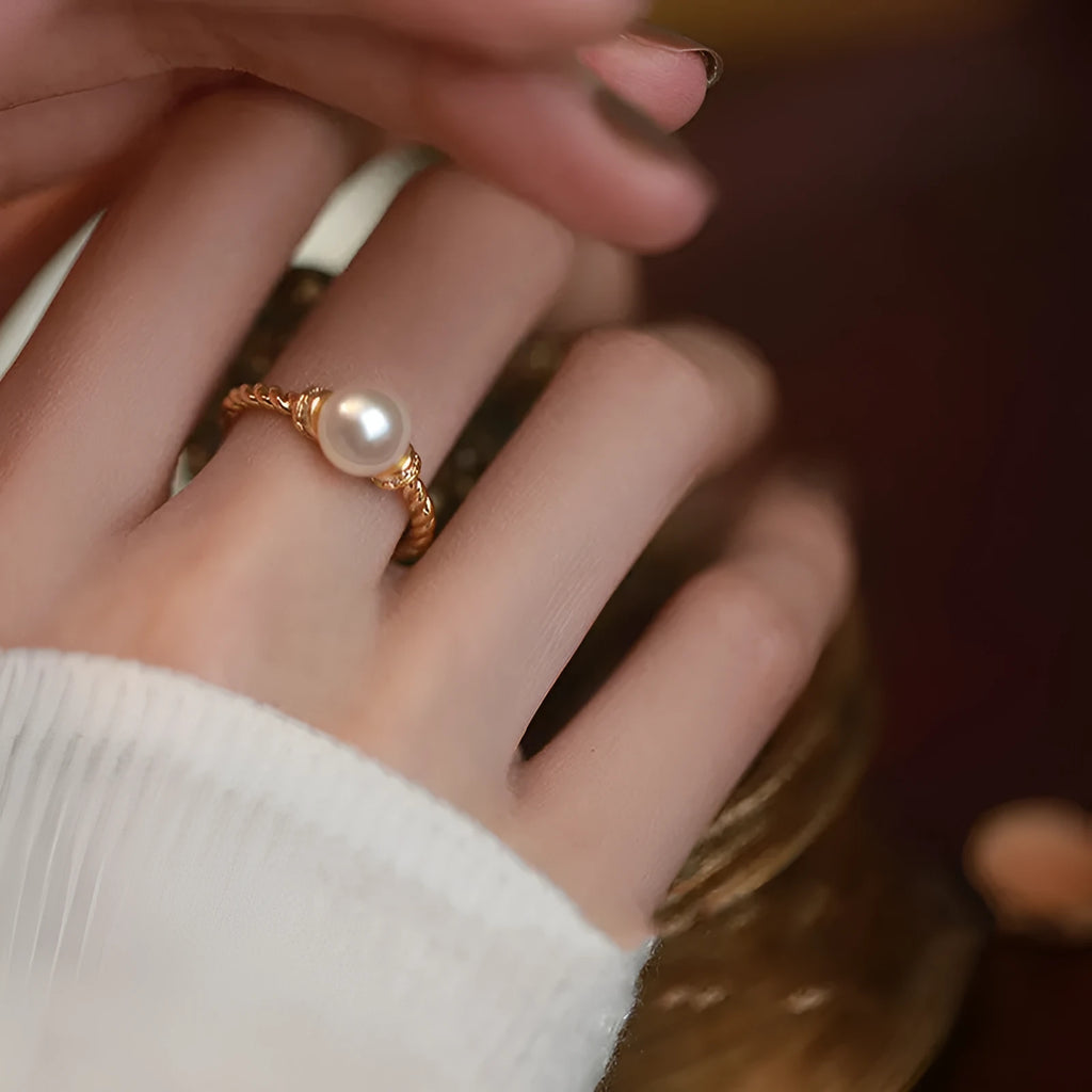 Adjustable copper ring with antique twist design and pearl inlay detail