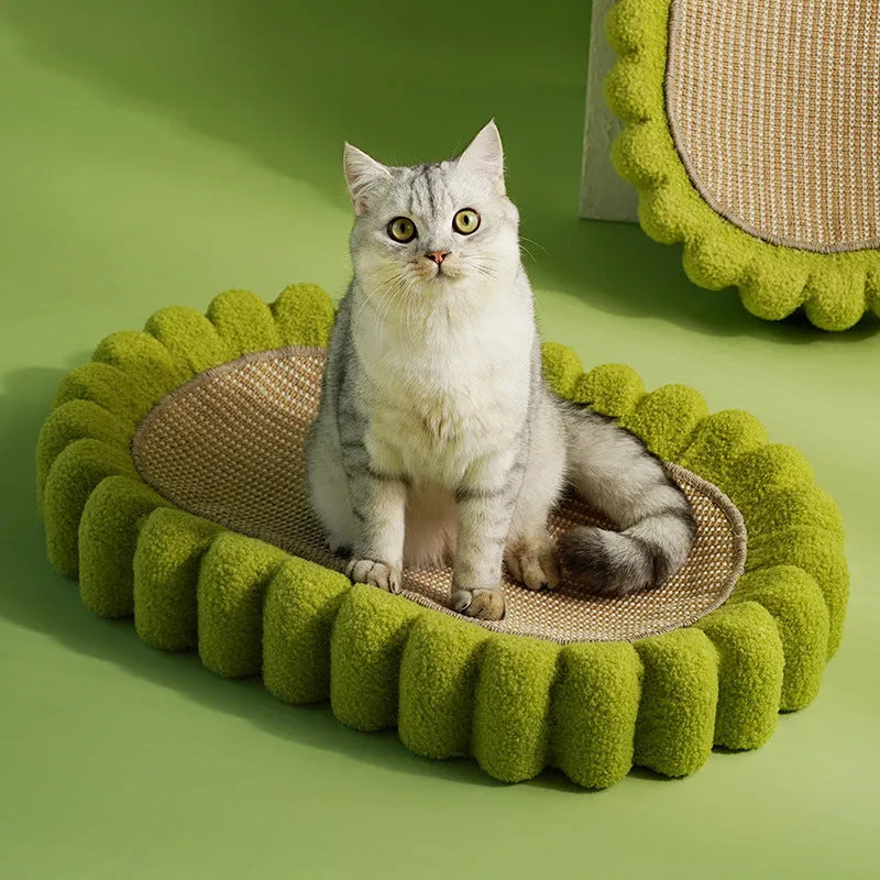 Green oval sisal cat scratching pad and bed measuring 650mm long