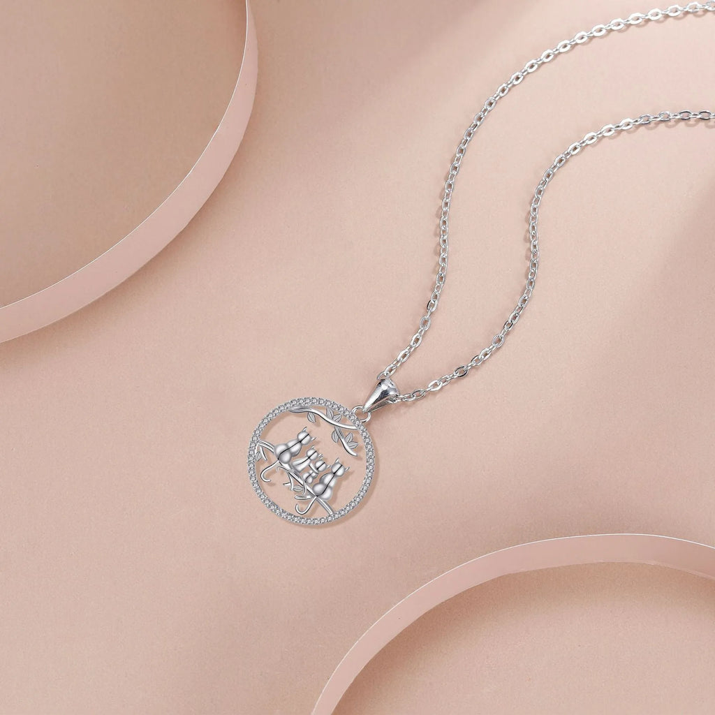 Women's necklace with four kitten pendant on copper cross chain, electroplated finish