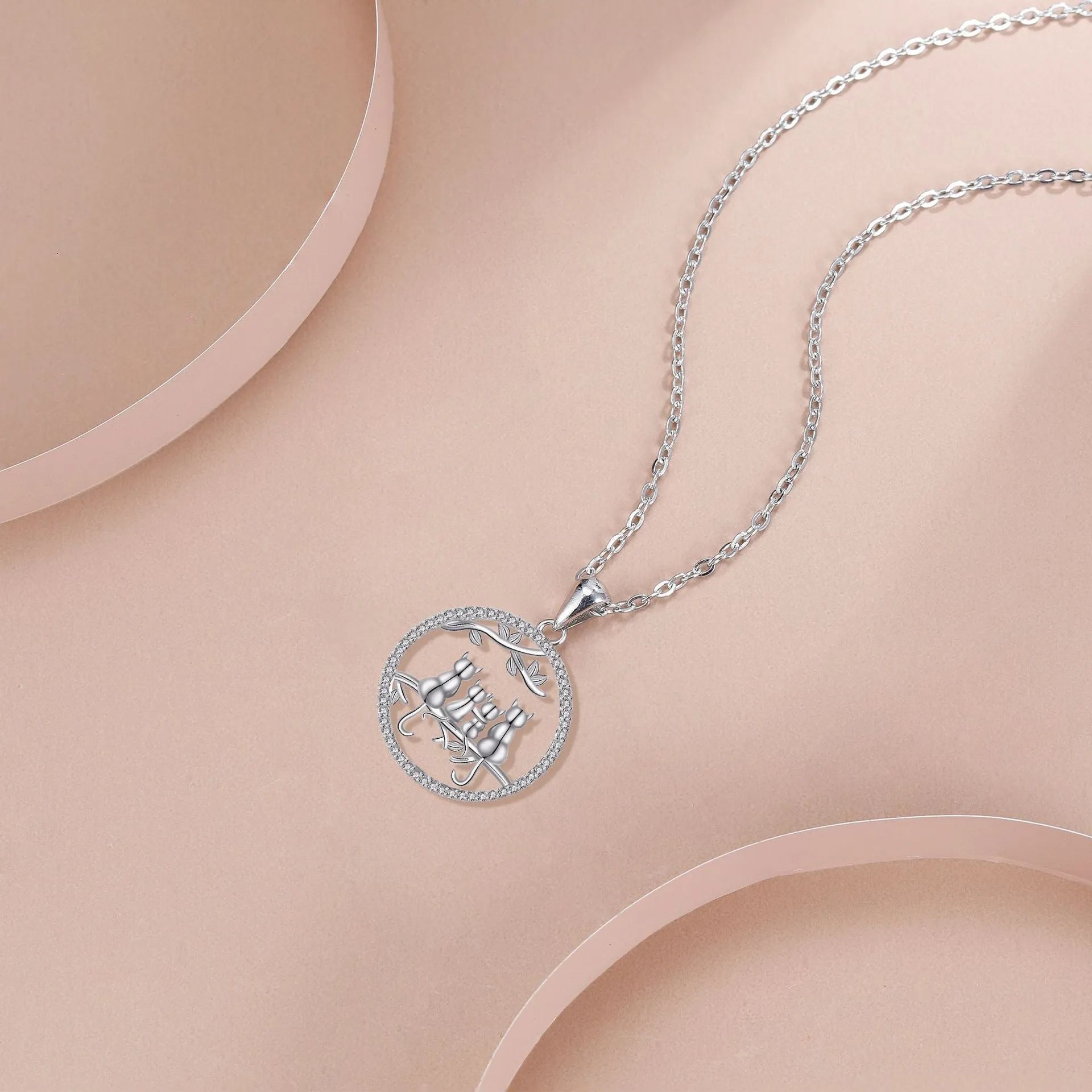 Women's necklace with four kitten pendant on copper cross chain, electroplated finish