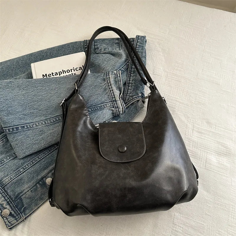 Women's PU leather commuter shoulder bag in horizontal square shape with single strap and optional pendant