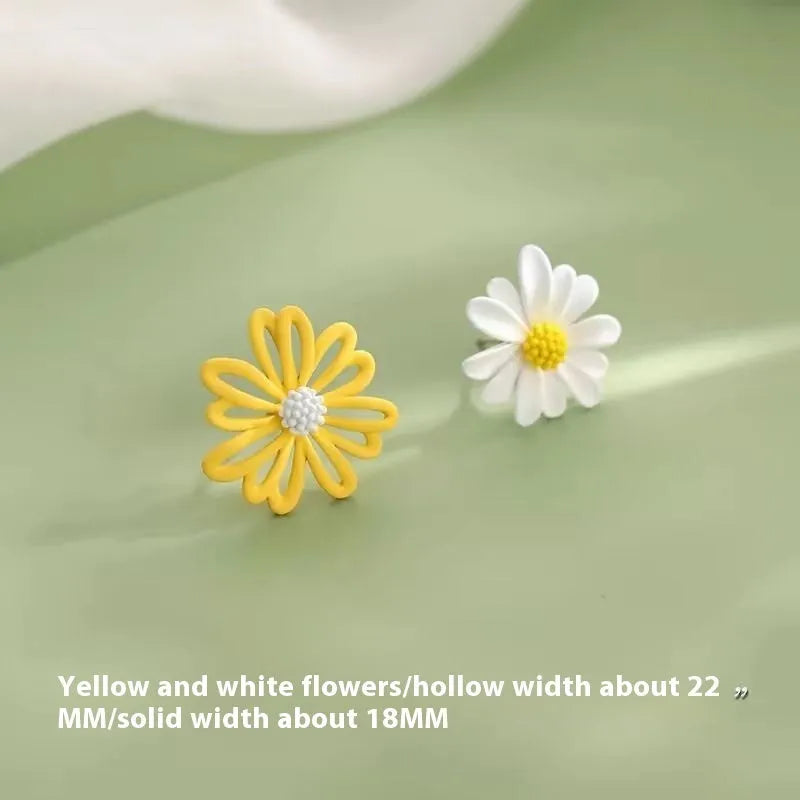 A pair of cartoon-style flower stud earrings in alloy, showing a blue and orange two-tone colour variant.