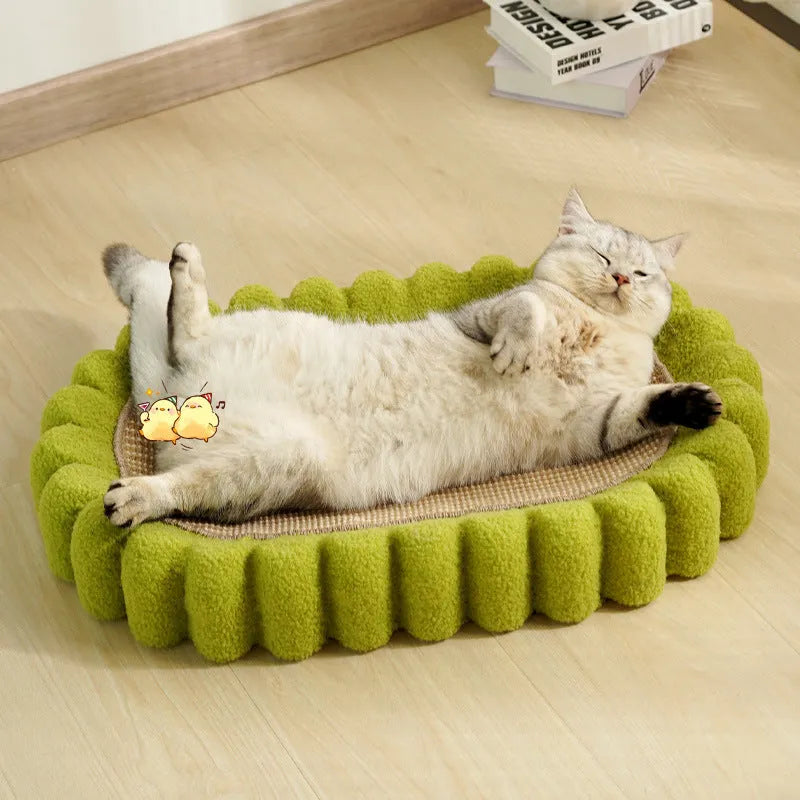 Green oval sisal cat scratching pad and bed measuring 650mm long