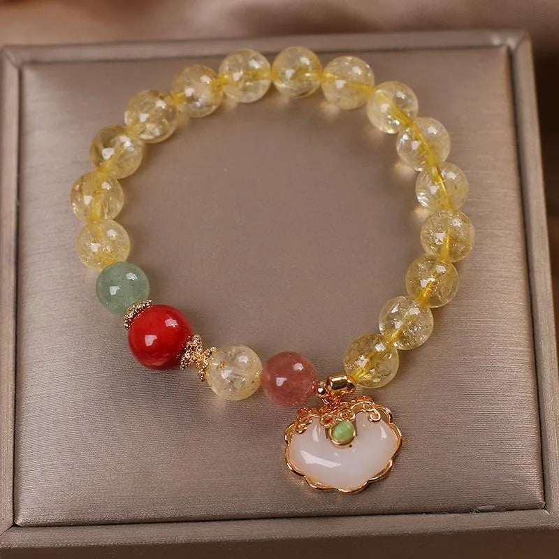 Original design women's alloy bracelet with a natural yellow hair crystal citrine jade ruyi pendant charm.