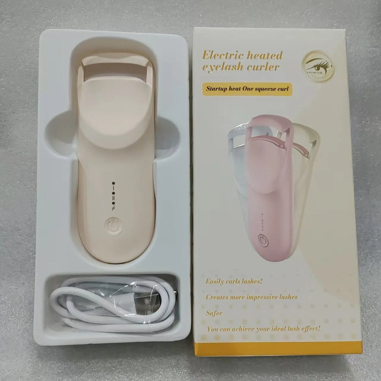 Plastic electric heating eyelash curler with USB cable in cream white colour