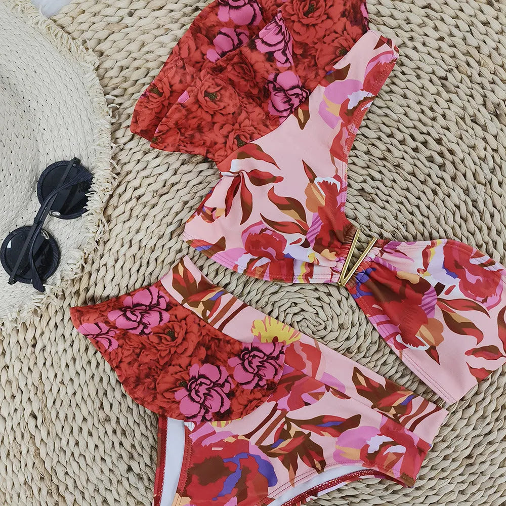 Women's one-shoulder ruffled floral print bikini with high-waist briefs in pink and red colours