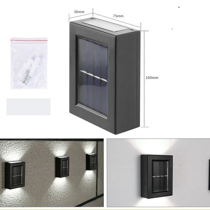 Solar garden wall light with upward and downward LED illumination for outdoor decorative lighting
