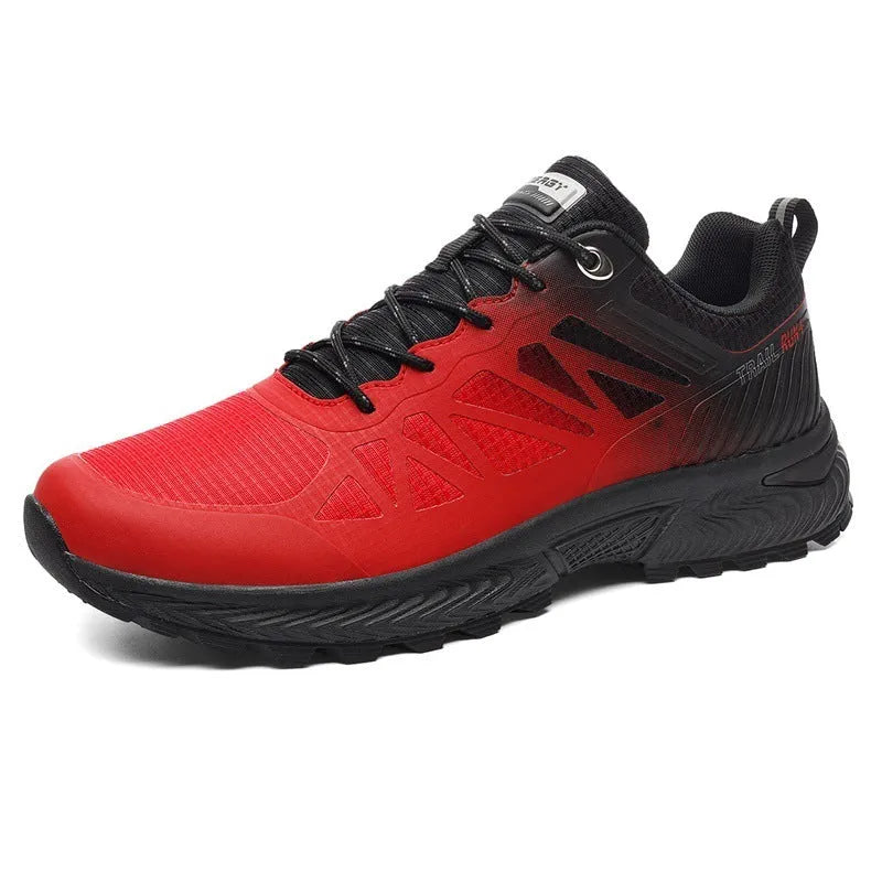 Men's black and orange mesh outdoor running shoe with round toe and flat heel on a rubber sole.
