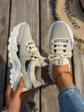 Women's Flyknit mesh lace-up sneakers in grey and white colourway