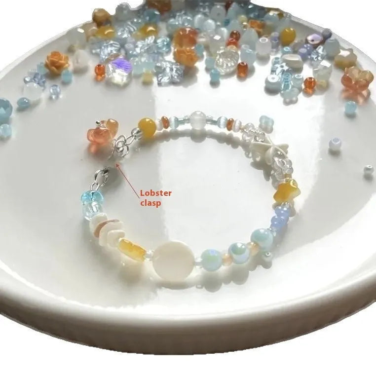 Orange mixed material women's bracelet with diamond shape and round seaside elements