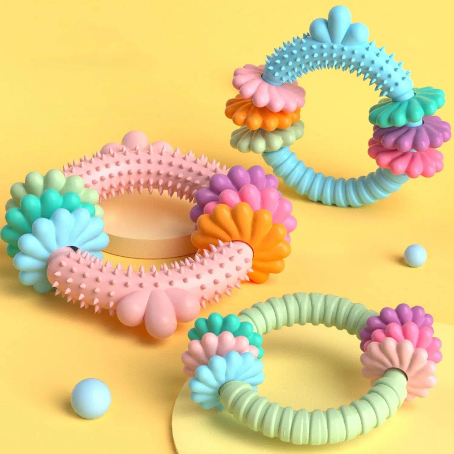 TPR dog chew toy for small dogs in blue, green, or pink colours with squeaky sound feature