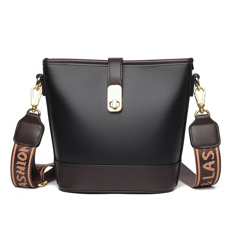Korean style soft PU bucket messenger bag with adjustable straps in black showing internal zipper compartments