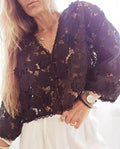 Loose V-neck cardigan with hollow lace sleeves and three-dimensional floral lace decoration in black