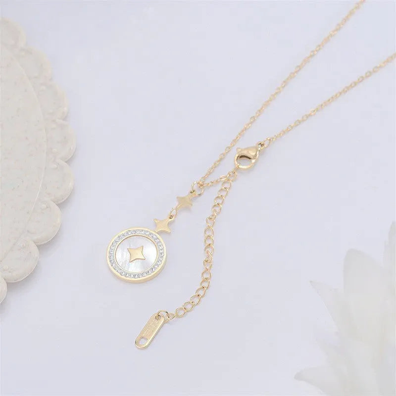Gold titanium steel necklace with six-pointed geometric star pendant on an O-ring chain.
