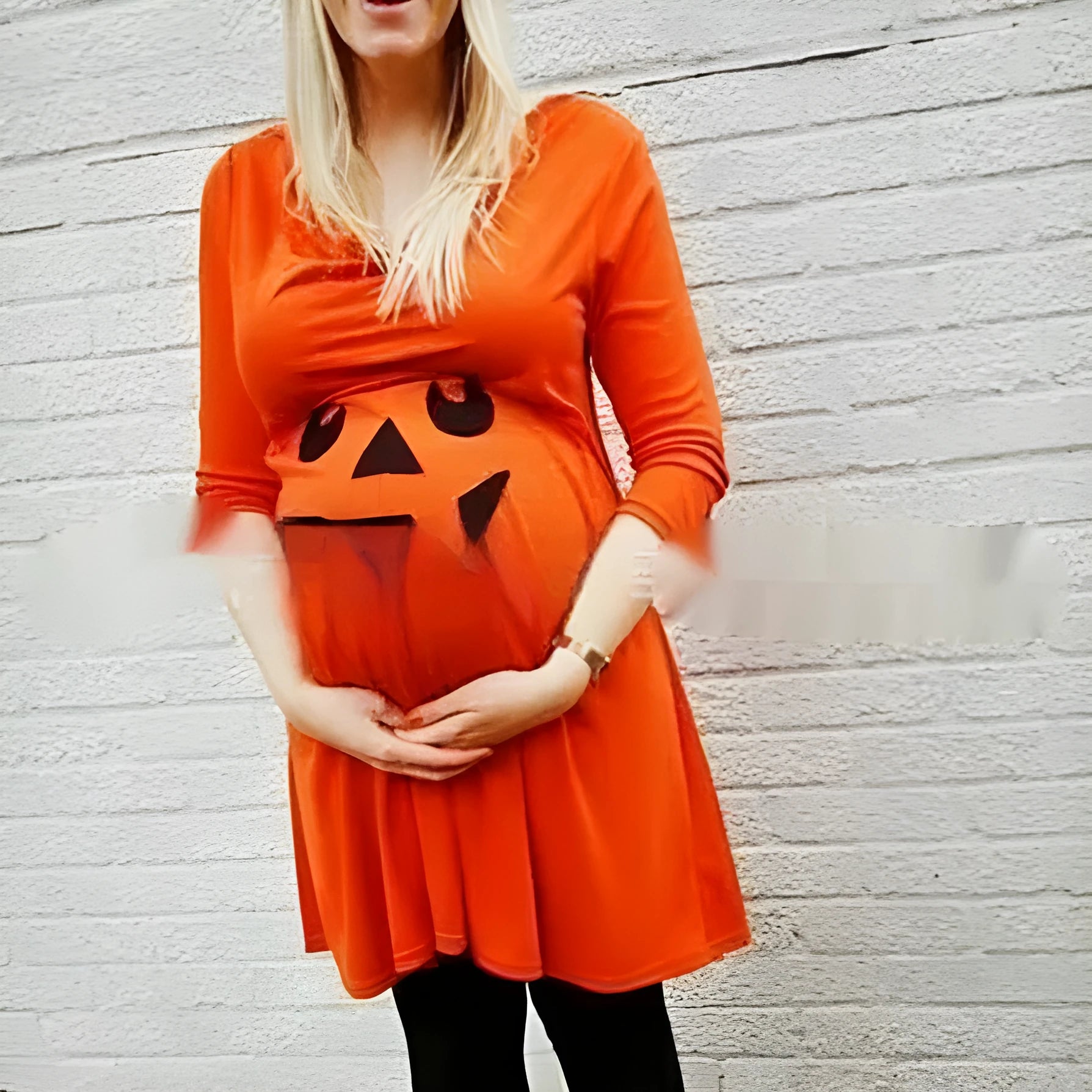 Orange cotton maternity dress on hanger showing Halloween colour and casual design