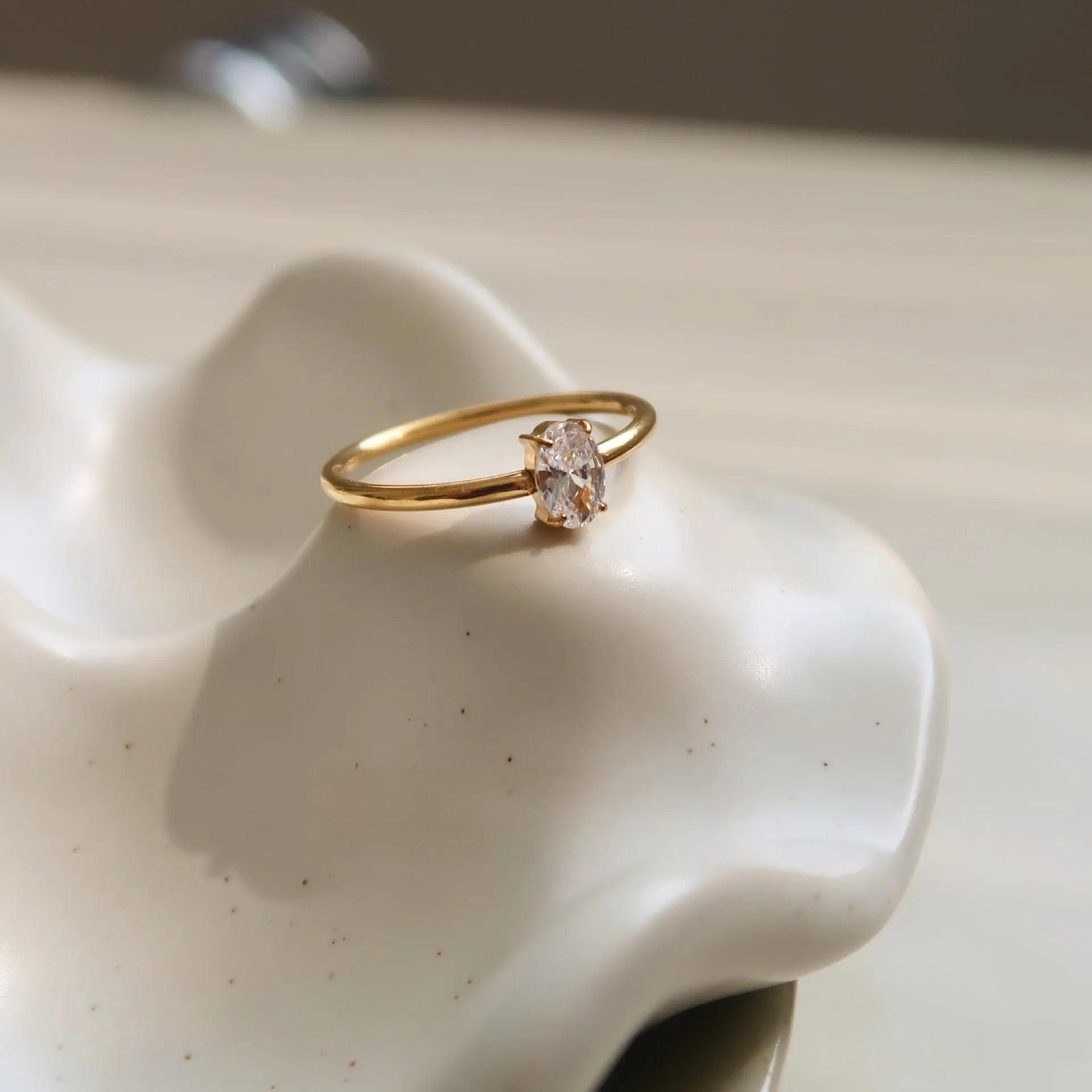 Golden electroplated stainless steel ring with love heart or oval design for women in sizes 6, 7 and 8