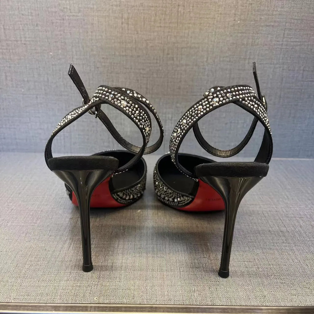 Women's black hollow high heels with red sole, stiletto heel and pointed toe design