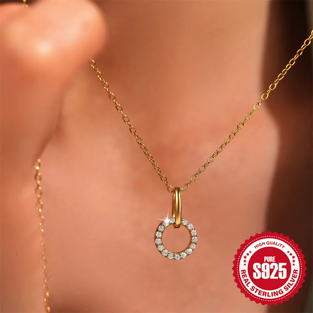 Gold coloured S925 sterling silver adjustable clavicle chain with a geometric round zircon pendant.