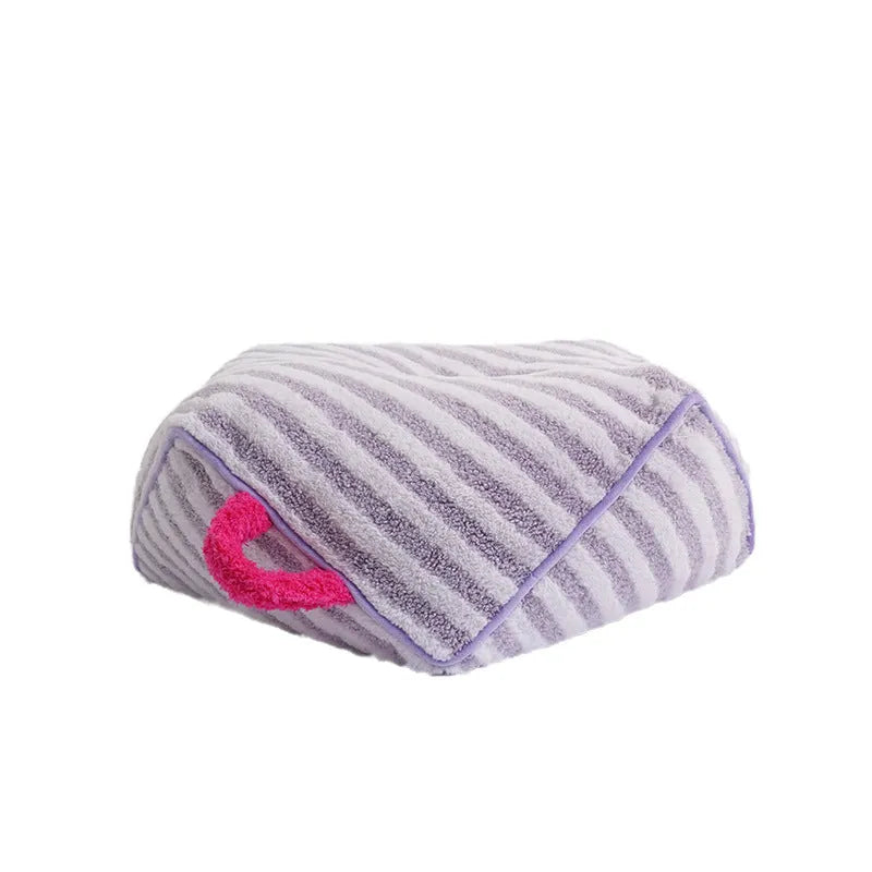 Striped soft velvet dog bed with removable cover in orange, purple, and yellow colour options.