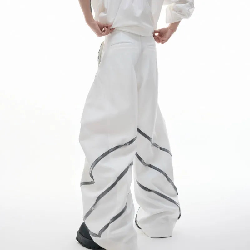 Men's polyester trousers with three-dimensional cut, metal striped rivets, and pleated front.