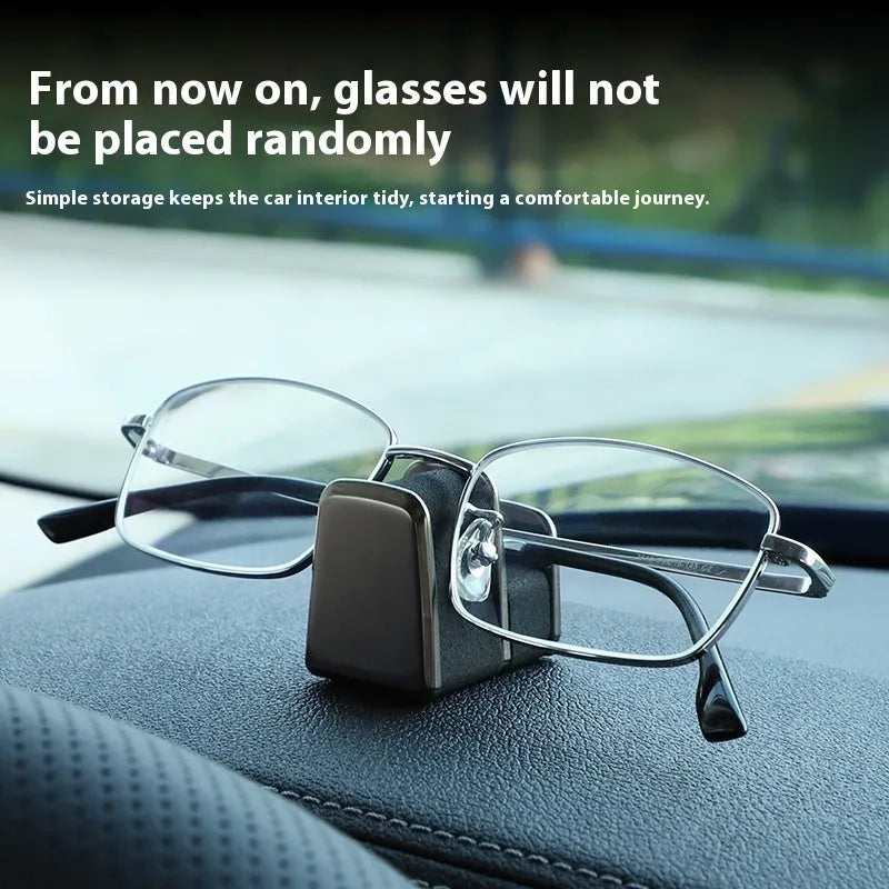 Zinc alloy and leather sunglasses clip for car dashboard storage in four colour options.