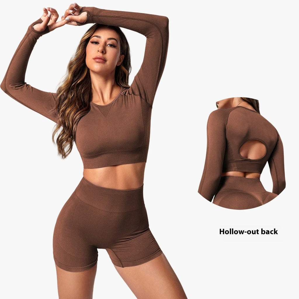Women's high-waist yoga suit in black, featuring a long sleeve top and tight-fit trousers.