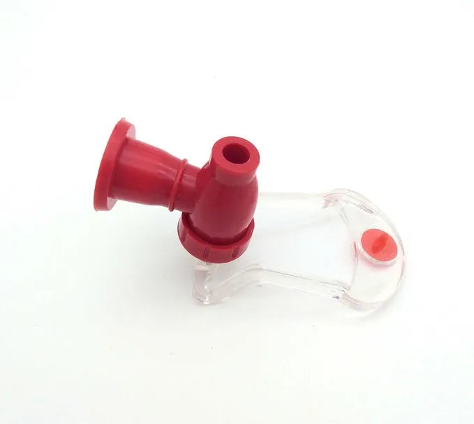 Red plastic Magic Tap soda dispenser attached to an inverted 2-litre bottle for serving fizzy drinks