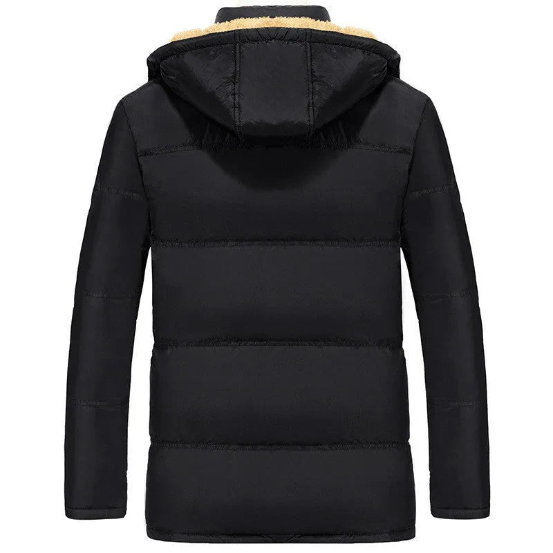 Men's black velvet padded jacket with hood and double-breasted buttons, showing loose fit.