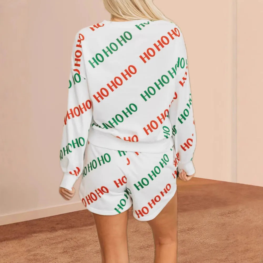 Women's white polyester two-piece suit set with letters printed design showing long sleeves and street fashion styling