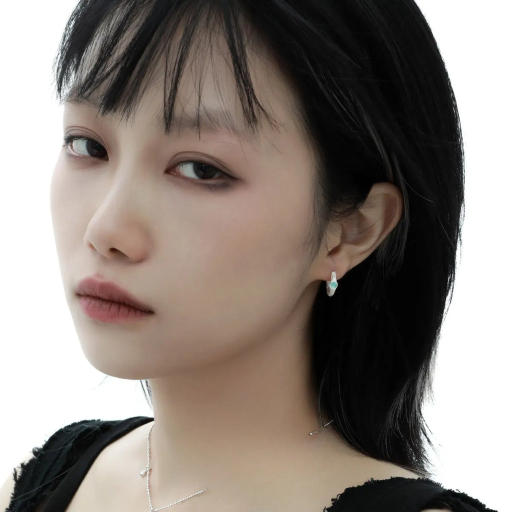 925 sterling silver ear clips with burnt silver finish and geometric circular design